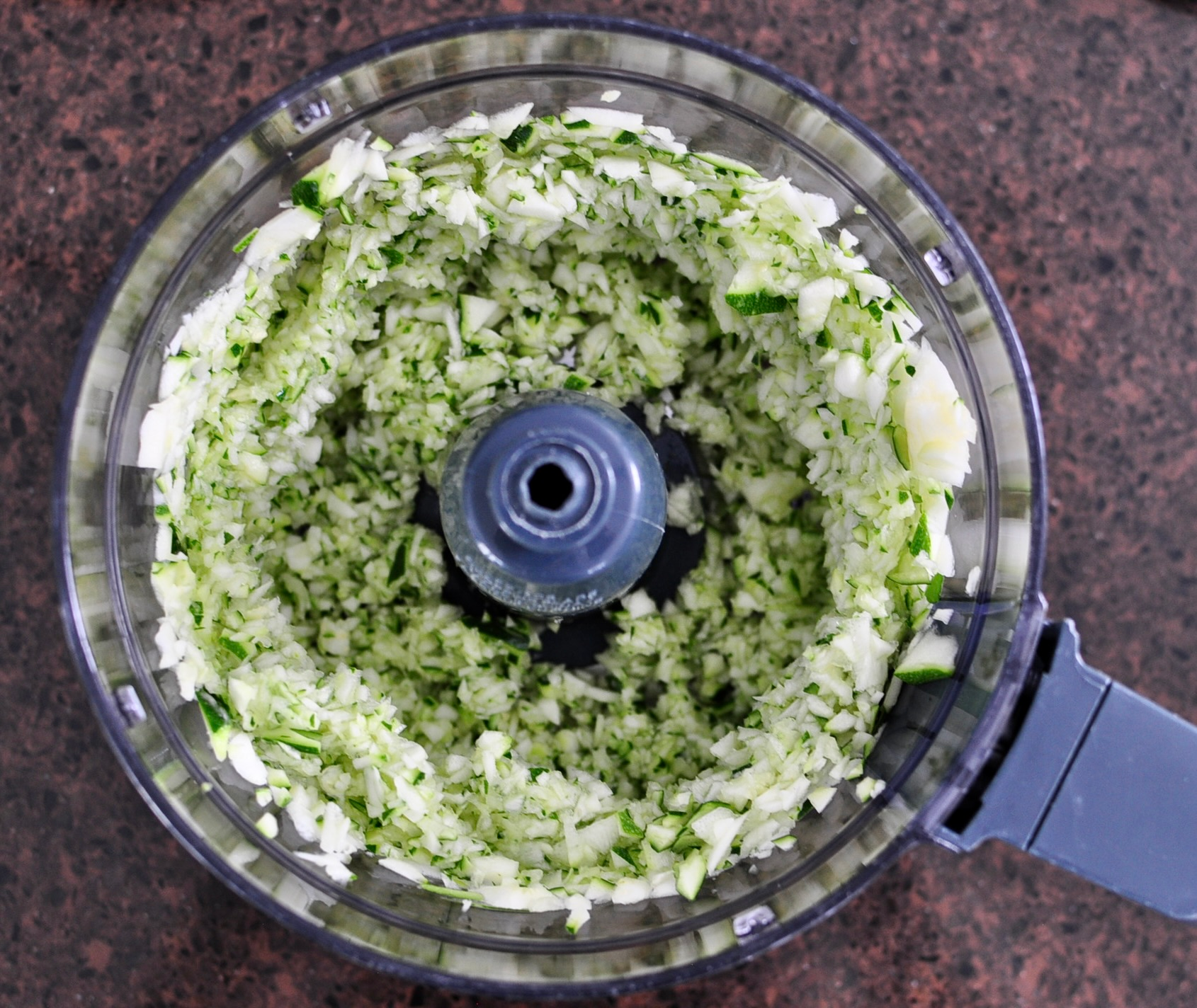 Shredded zucchini on food processor