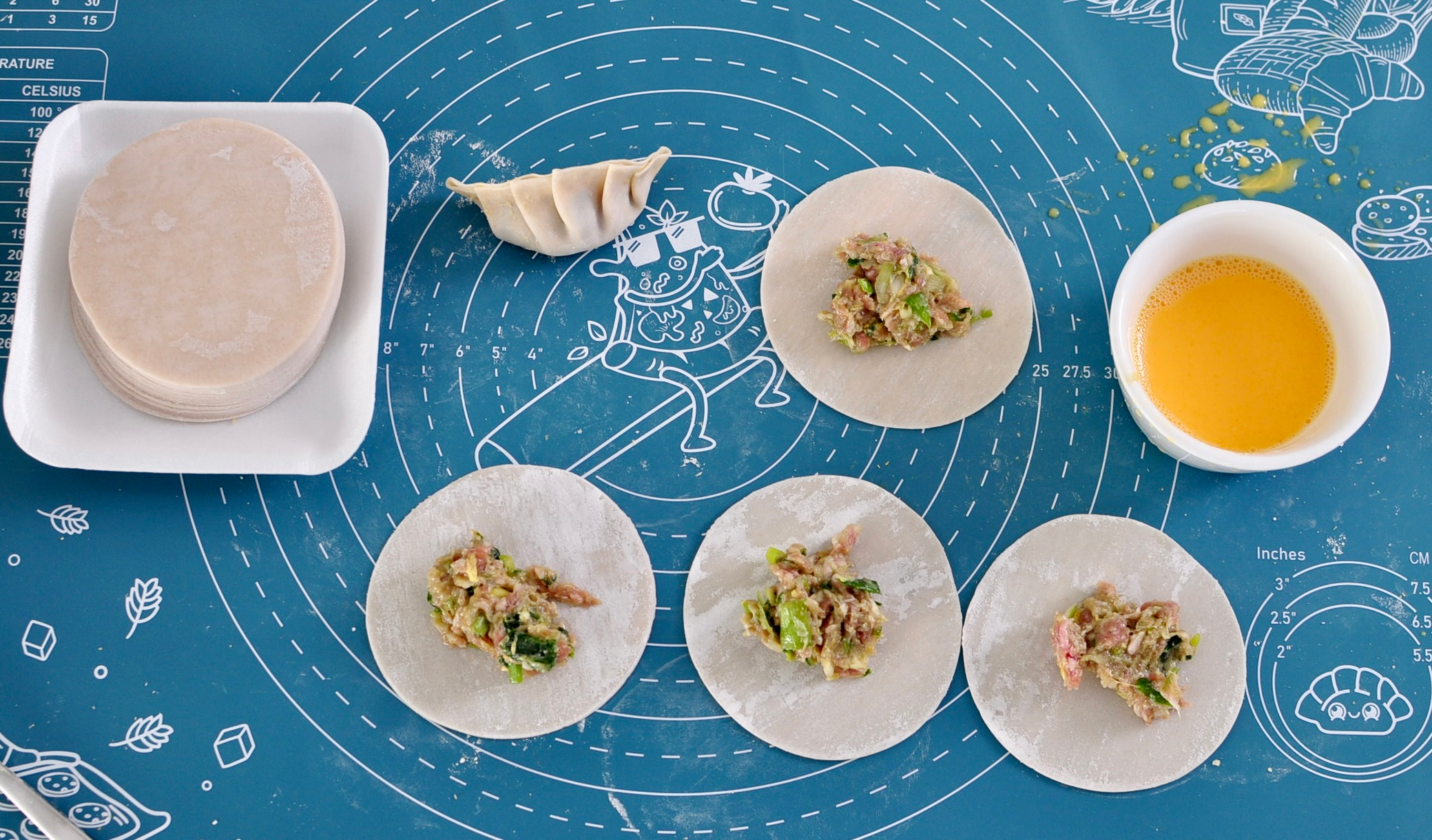 Wrapping pork and leek dumplings