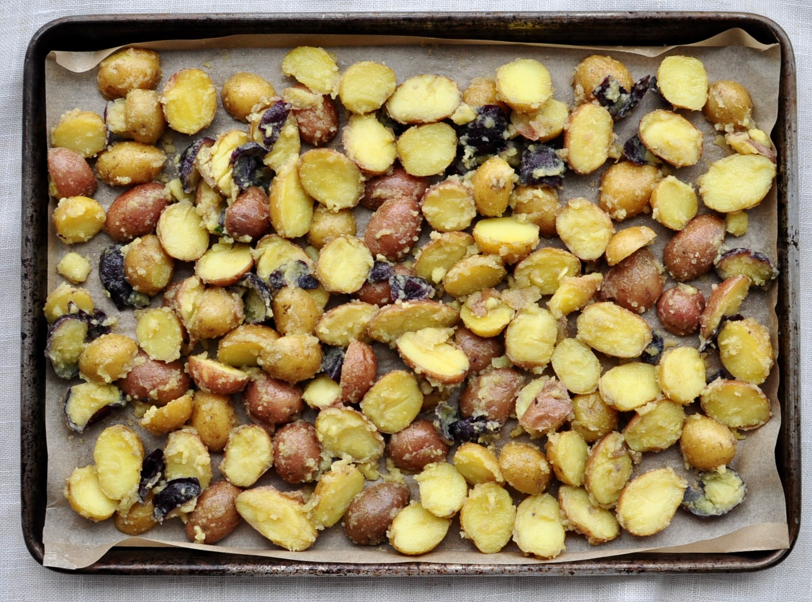 Beef Tallow Potatoes arranged on a baking sheet