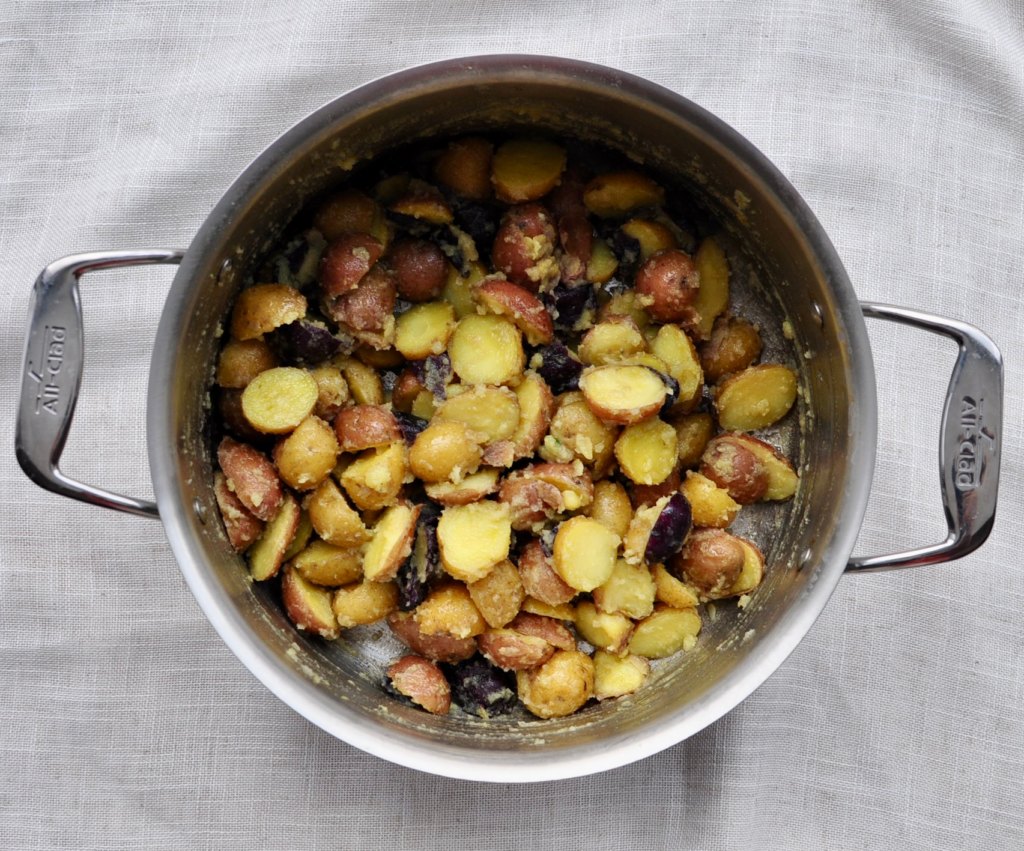 Toss the infused beef tallow with the potatoes.