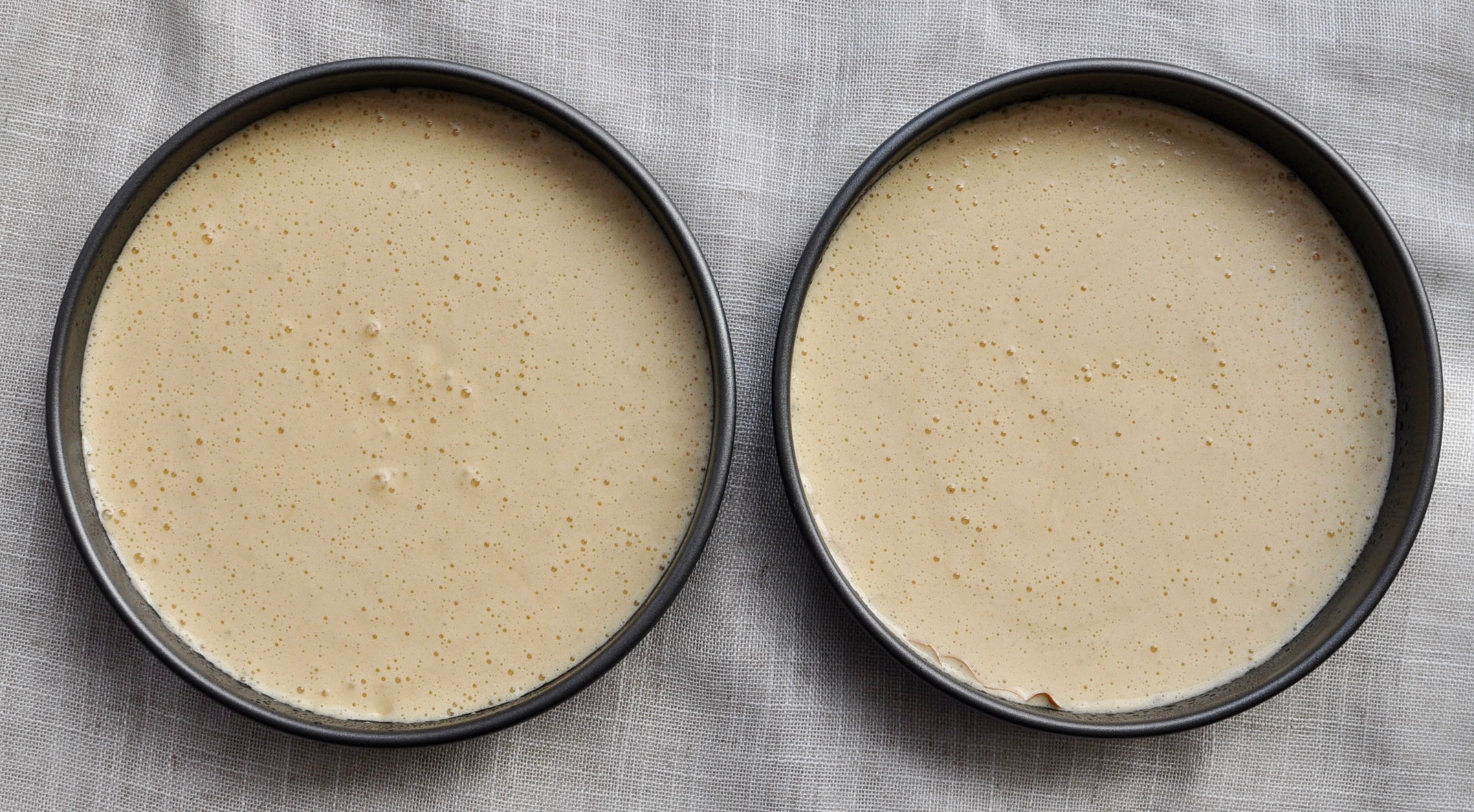 Cake batter in cake pans