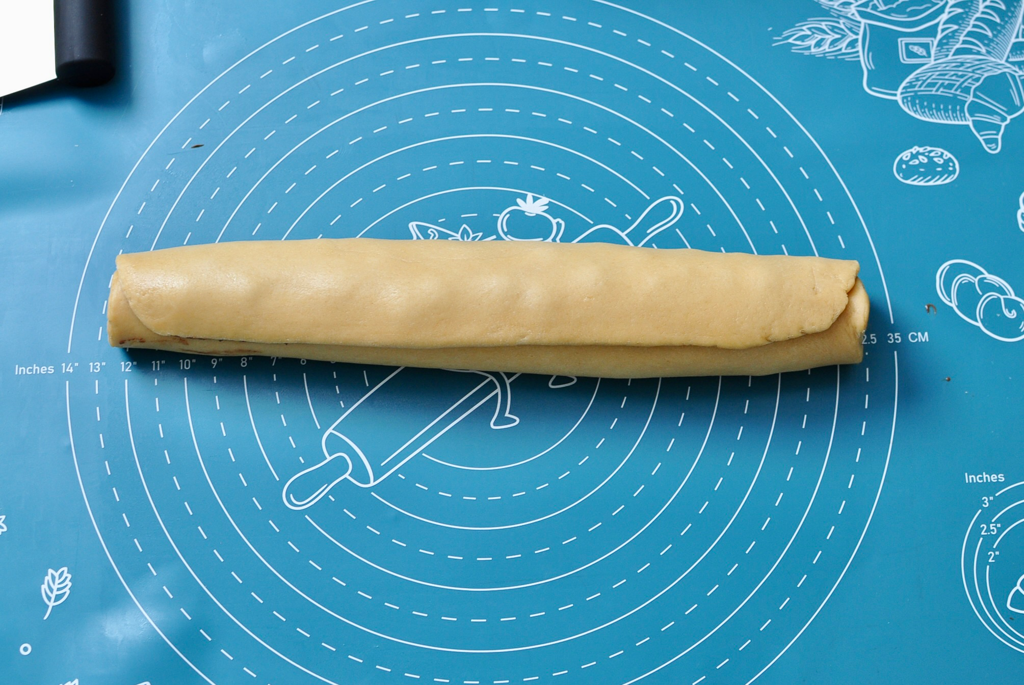 Babka dough rolled into a log