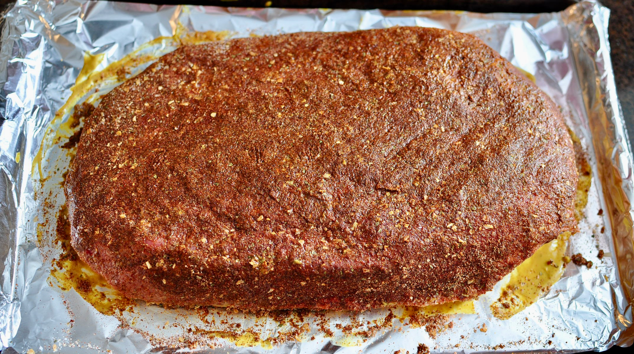 Rub spice rub on brisket