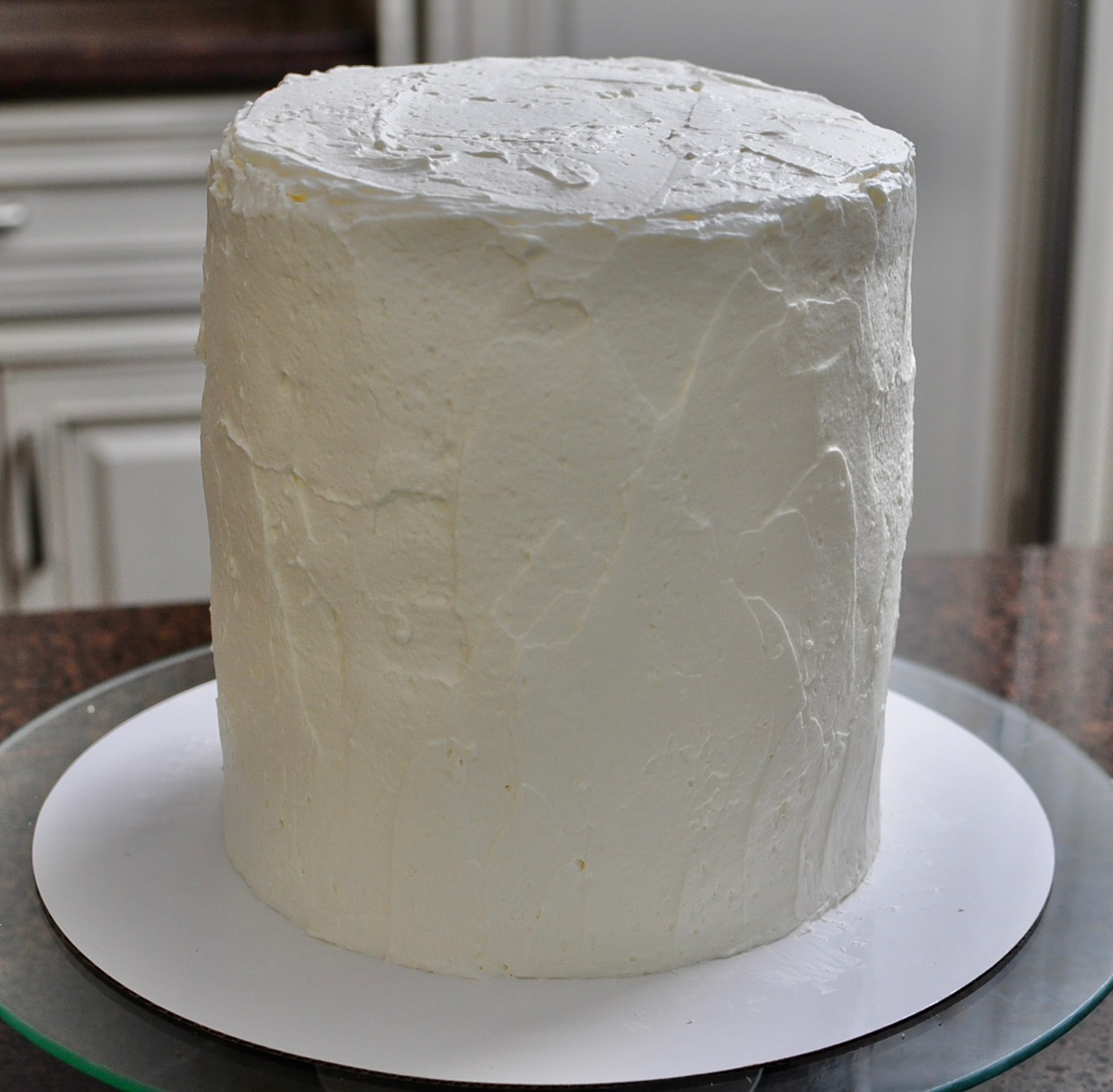Whipped cream frosting on a 5 inch 5 layer vanilla cake
