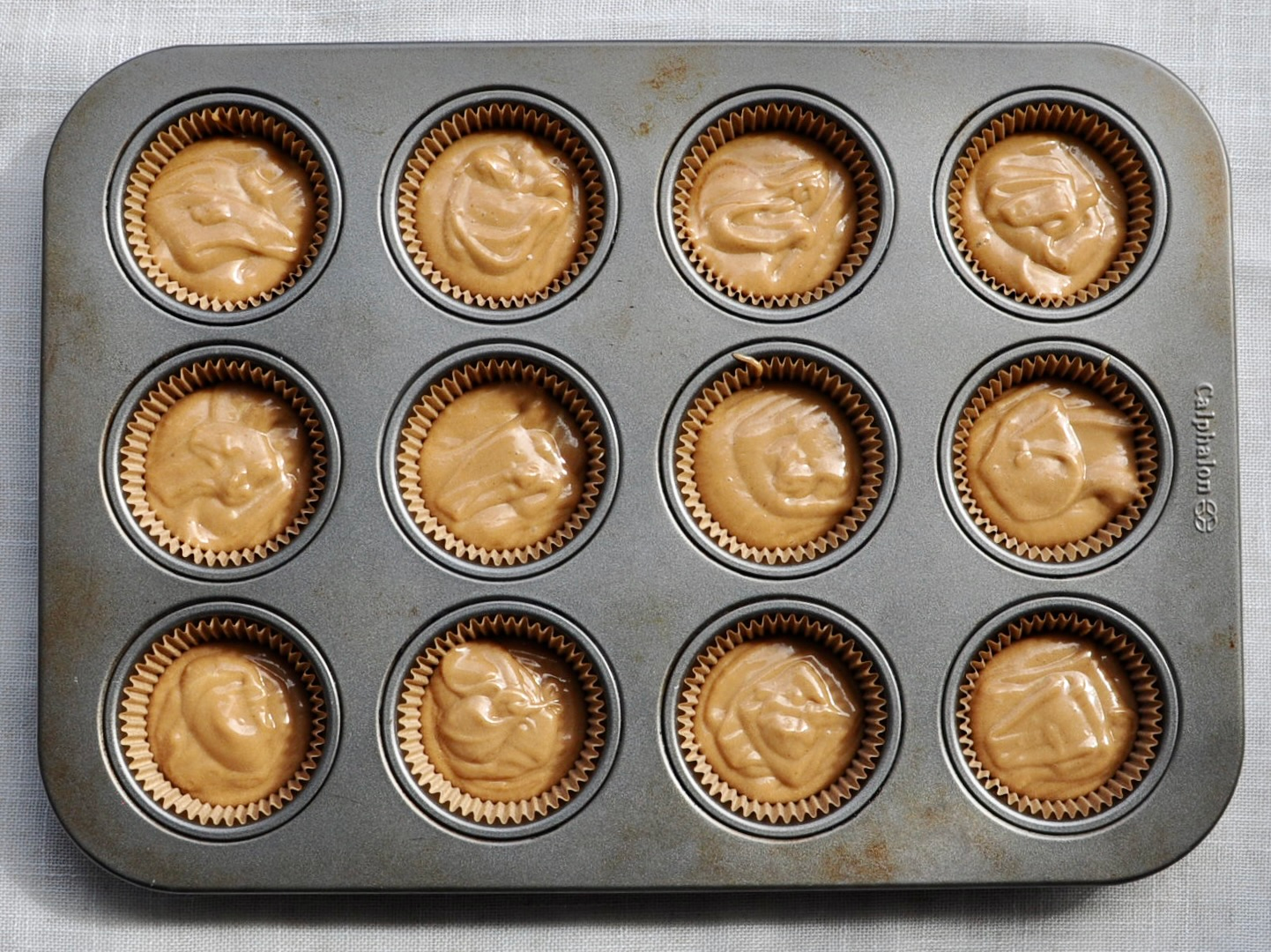 milk tea cupcake batter in cupcake tin