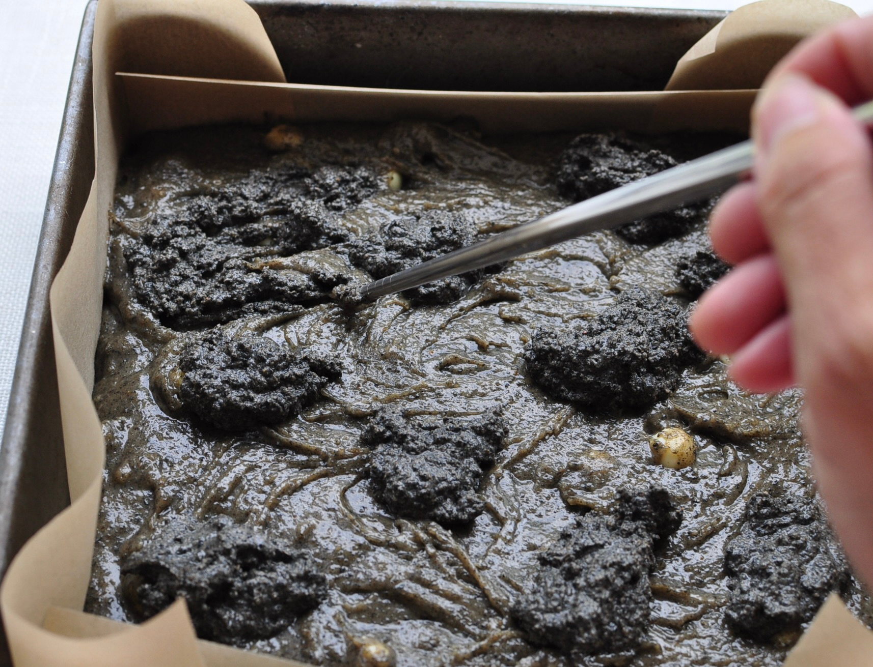 black sesame paste swirls on black sesame brownies