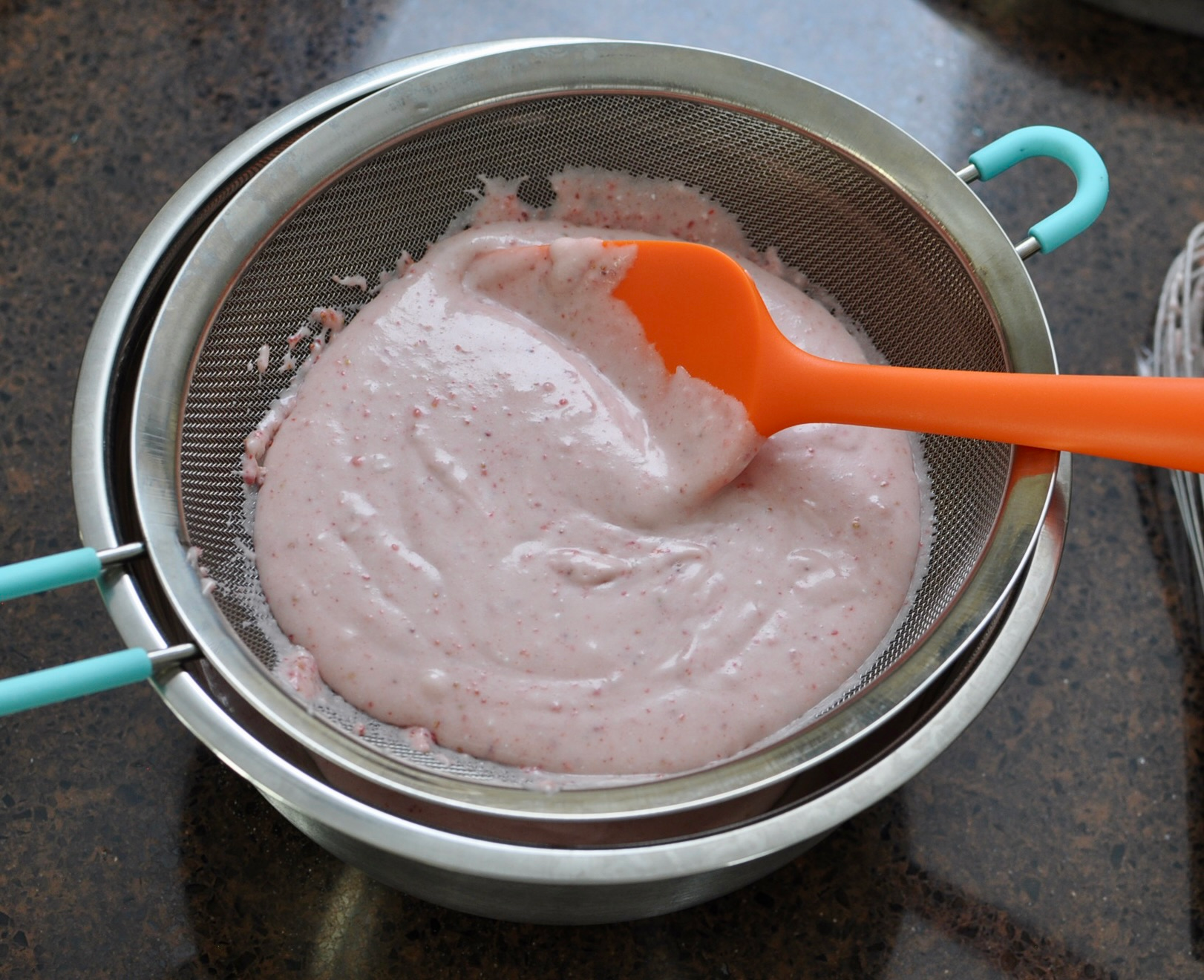 Strawberry Mochi Batter in Mesh Strainer for smooth batter